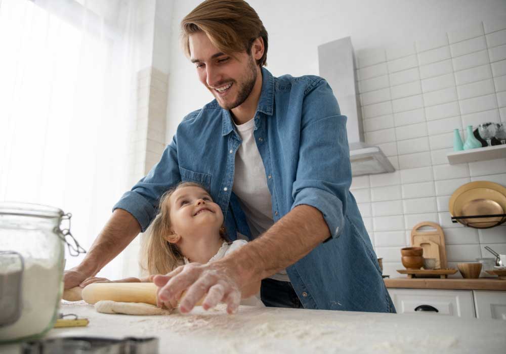 Young father and daughter baking